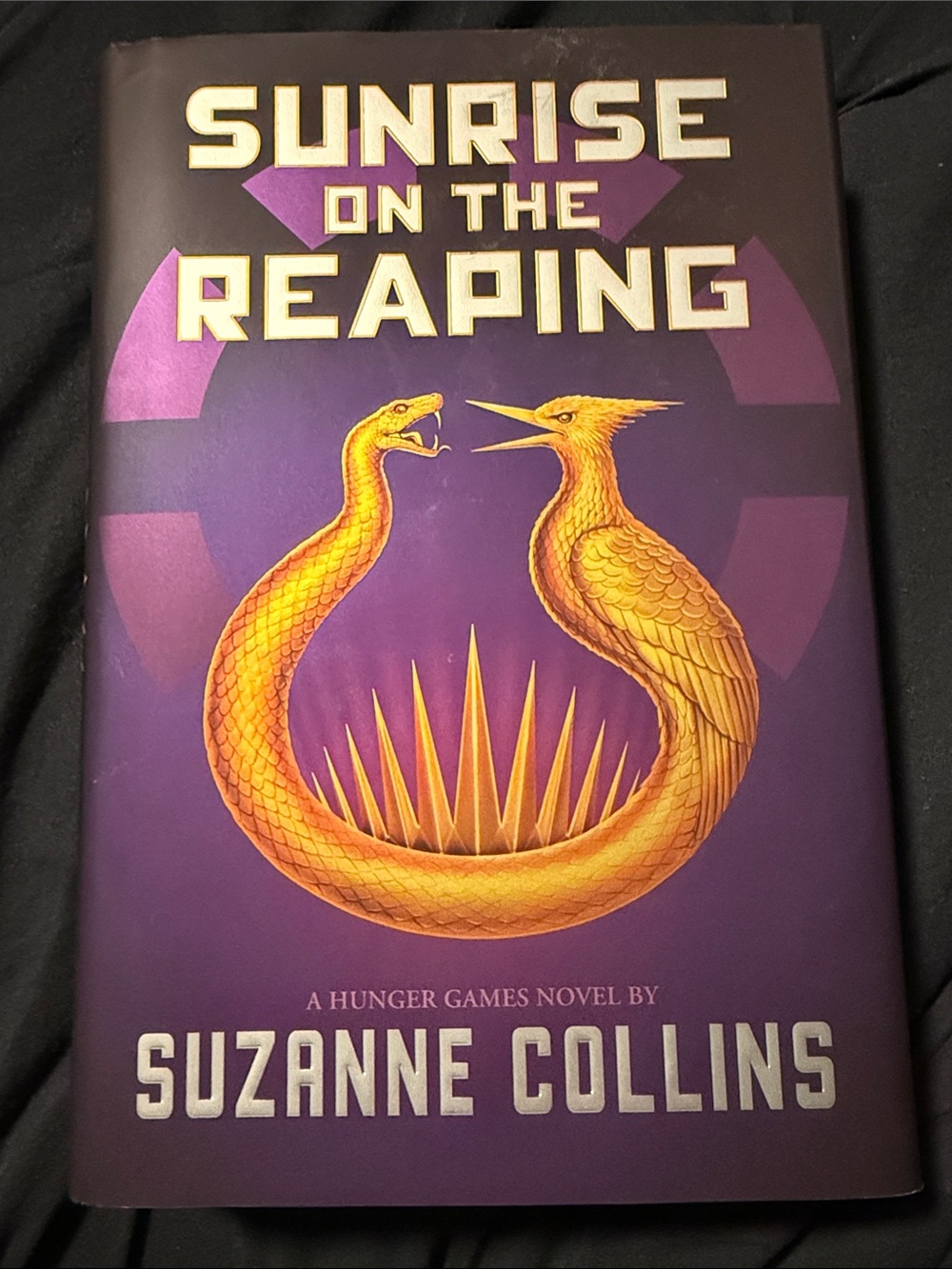 Scholastic Purple Hardcover with Gold Serpent and Bird Emblem